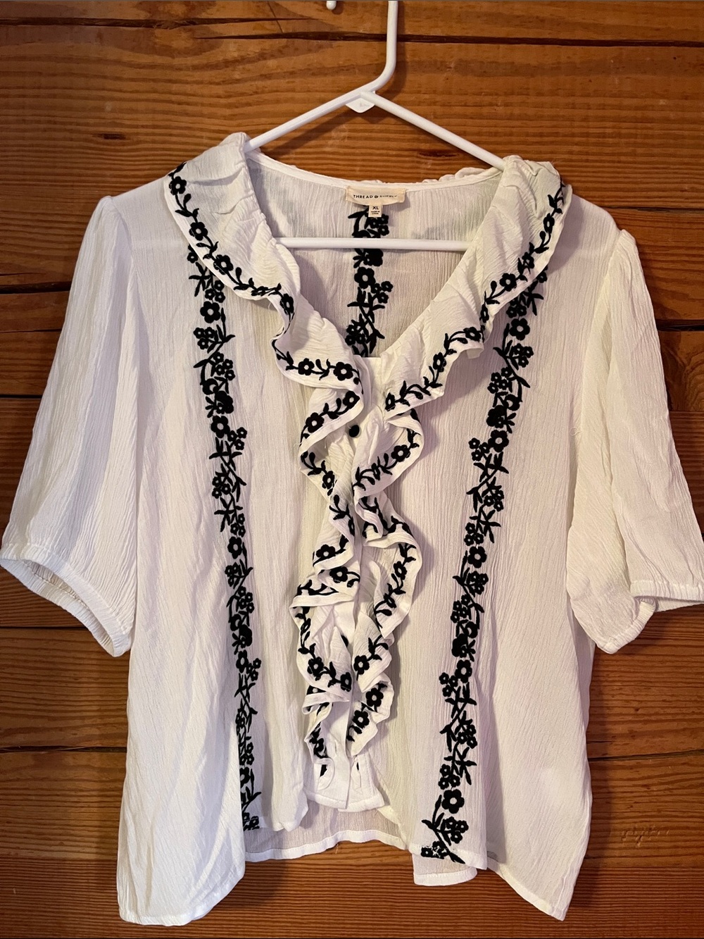 Thread & Supply White Blouse with Black Floral Embroidery and Ruffle Trim